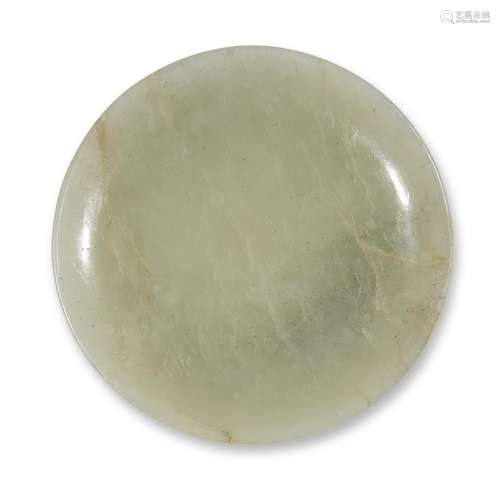 A Chinese carved pale celadon jade circular snuff dish