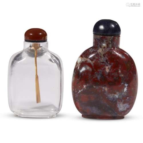 A Chinese carved red jasper snuff bottle and a rock crystal snuff bottle