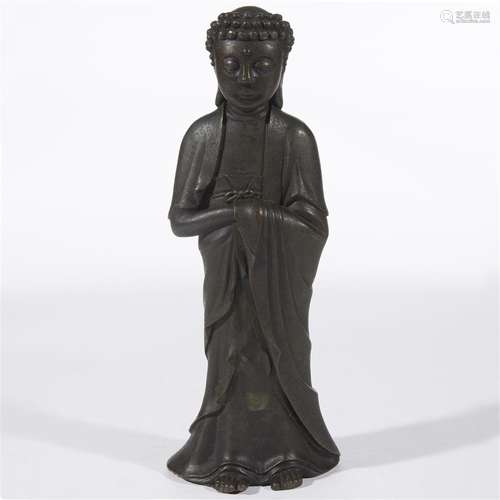 A Chinese patinated bronze figure of standing Buddha