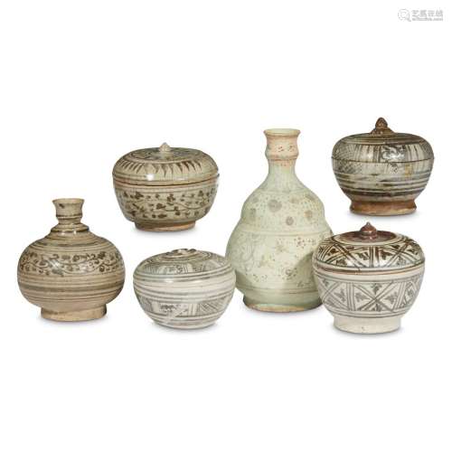 A group of four Thai iron brown-decorated stoneware covered boxes and a bottle vase, Sawankhalok kilns