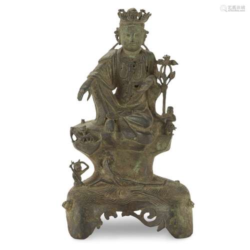 A Chinese bronze figure of a seated Guanyin