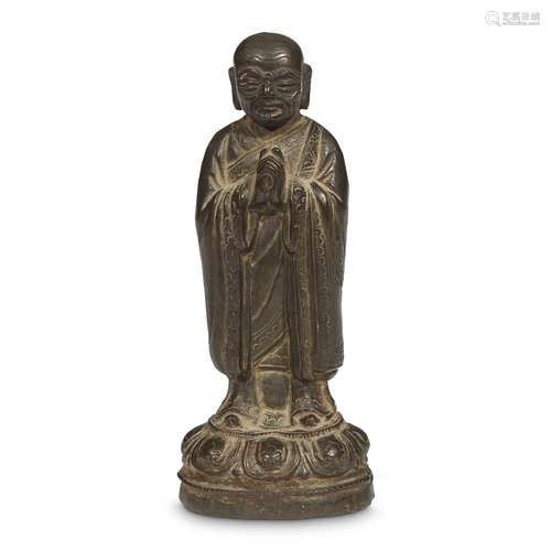 A Chinese bronze figure of a Buddhist attendant