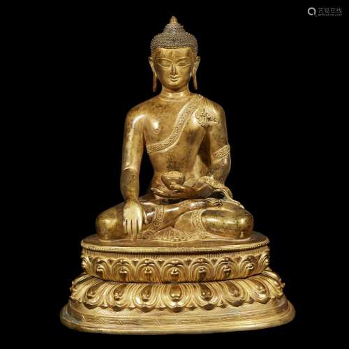 An exquisitely cast and chased Nepalese gilt bronze figure of Buddha