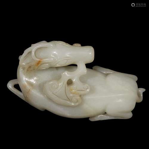 A Chinese carved greyish-white jade 