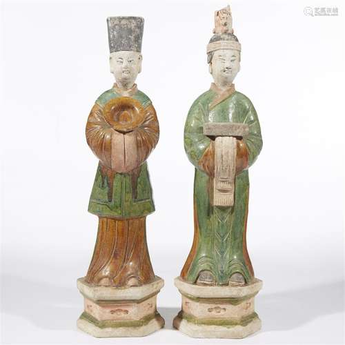 A pair of Chinese sancai-glazed and painted pottery attendants