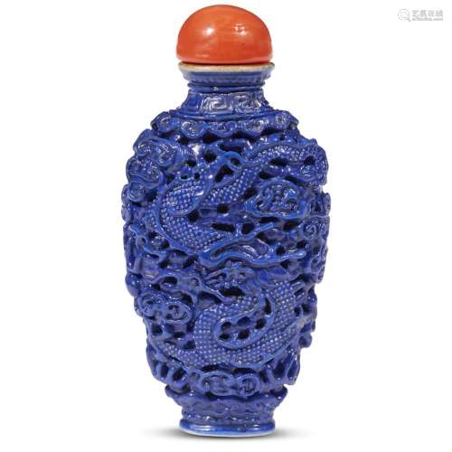 A Chinese cobalt blue-enameled carved and molded porcelain 
