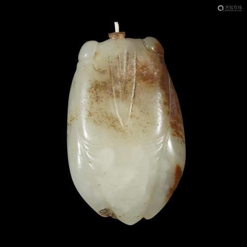 A Chinese carved white and russett jade 