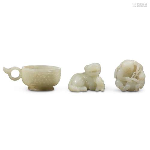 Three Chinese carved white and pale celadon jades: 