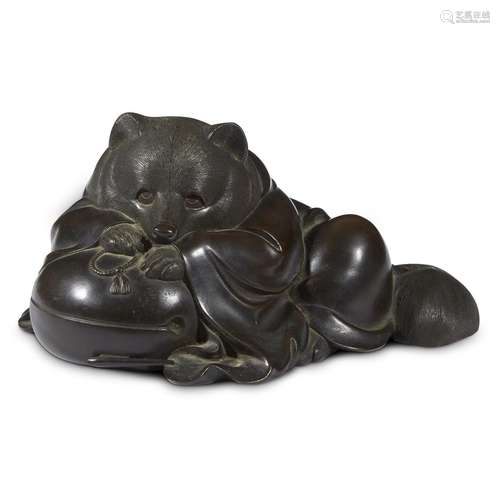 A Japanese patinated bronze tanuki