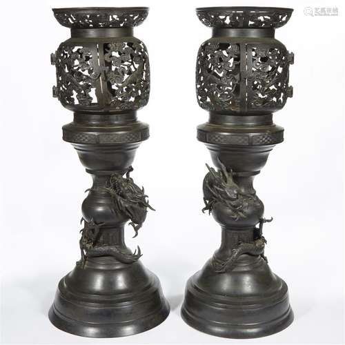 A pair of Japanese patinated bronze 