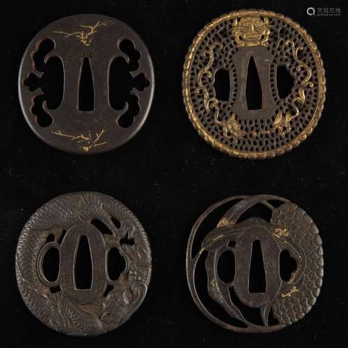 A group of four Japanese iron tsuba