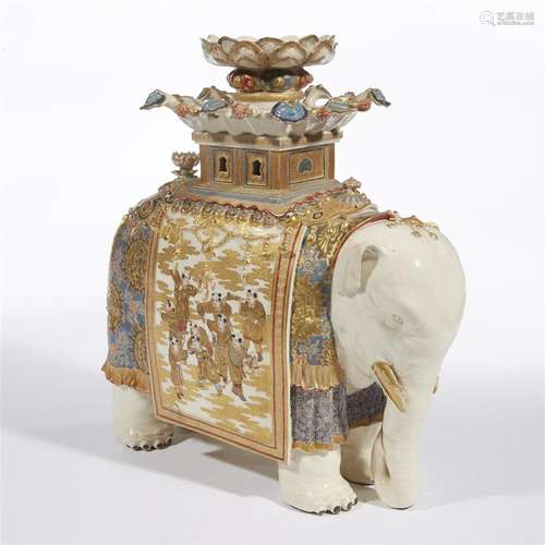 A large Japanese Satsuma-type enameled and gilt pottery figure of a caparisoned elephant