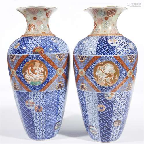 A pair of Japanese porcelain vases decorated in an Imari palette, Fukagawa