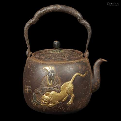 *A Japanese gold and patinated metal-inlaid iron teapot, tetsubin