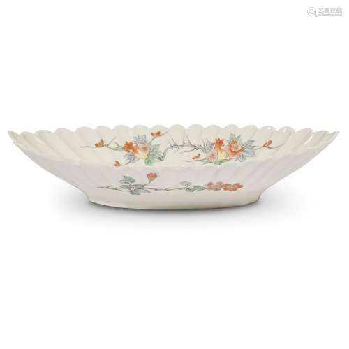 A Japanese porcelain fluted oval dish decorated in Kakiemon palette