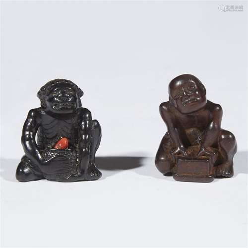 Two Japanese carved wood netsuke