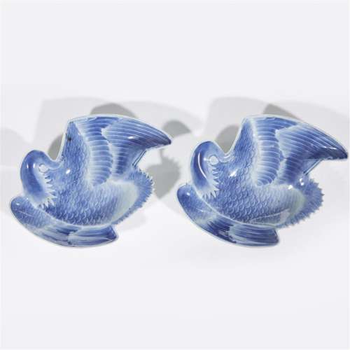 A pair of Japanese molded blue and white porcelain crane-shaped dishes