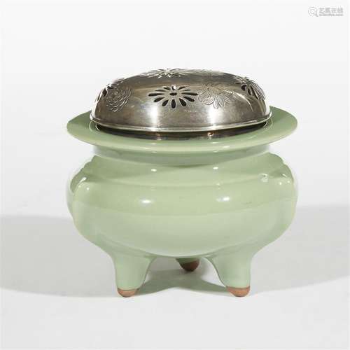 A Japanese celadon-glazed tripod censer with pierced and engraved silver cover