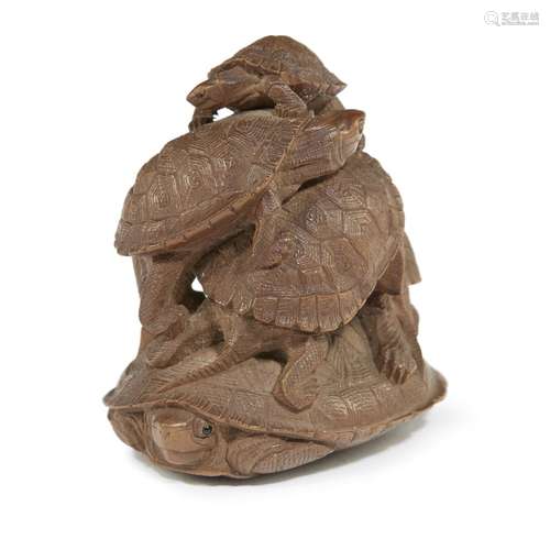 A Japanese carved wood netsuke depicting five clambering tortoises, Tadaichi