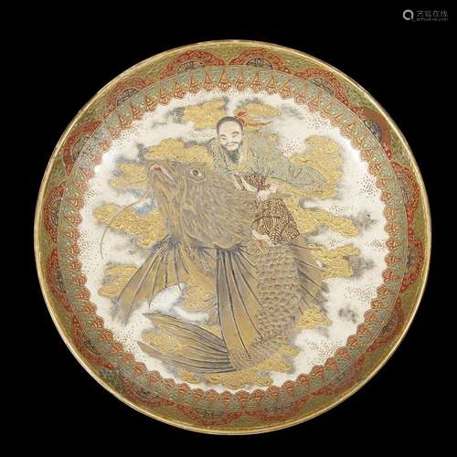 A Japanese enameled Satsuma-type dish depicting Ebisu riding a carp among scrolling clouds