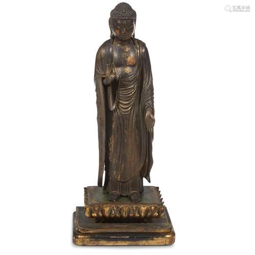 A Japanese carved and gilt-lacquered wood figure of standing Amida Buddha