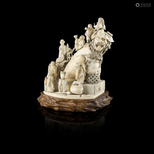 Y FINE IVORY FIGURAL OKIMONO OF SHICHIFUKUJIN AND A SHISHI LION