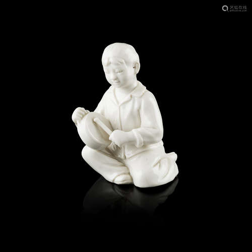 SMALL BLANC-DE-CHINE FIGURE OF A BOY