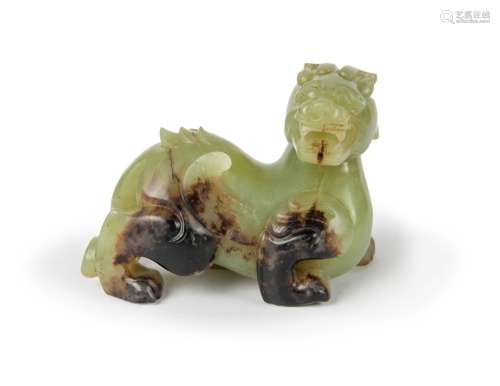 A CELADON JADE FIGURE OF A QILIN