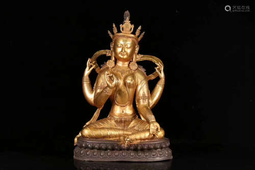 18TH CENTURY, AN OLD TIBETAN FOUR ARMS GUAN YIN DESIGN GILT BRONZE ORNAMENT