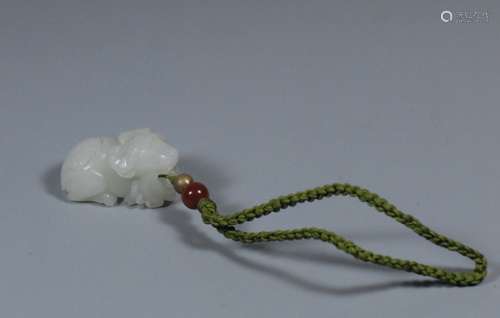 CARVED JADE OX WITH CORAL AND GILT BEAD