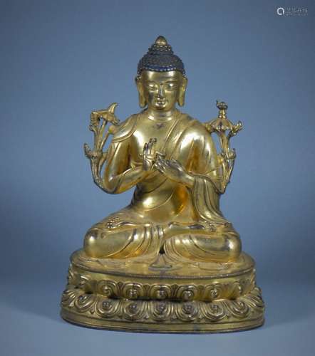 A GILT BRONZE FIGURE OF SAKYAMUNI