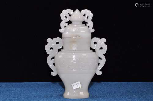 A FINELY CARVED JADE VASE AND COVER