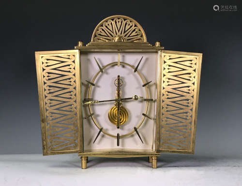 SMALL BRASS CARRIAGE SKELTON CLOCK