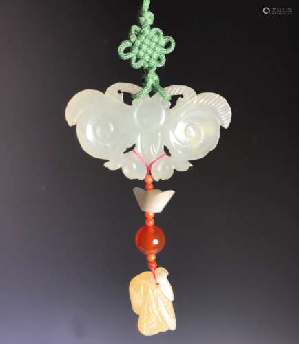 CARVED JADE PLAQUE ON SILK CORD