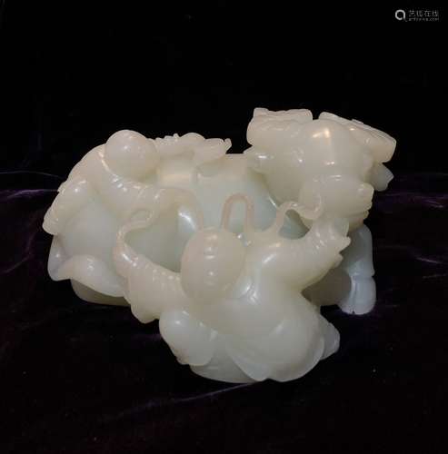 FINELY CARVED WHITE JADE OX WITH HANDLERS