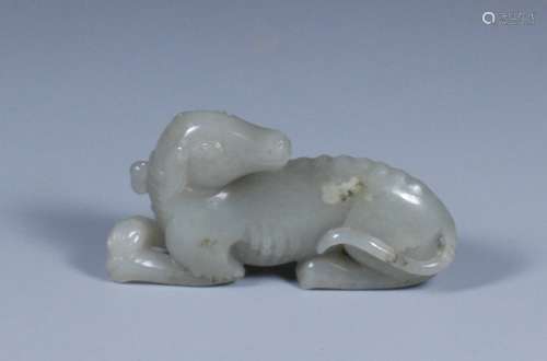 JADE CARVING OF A LYING DOG.