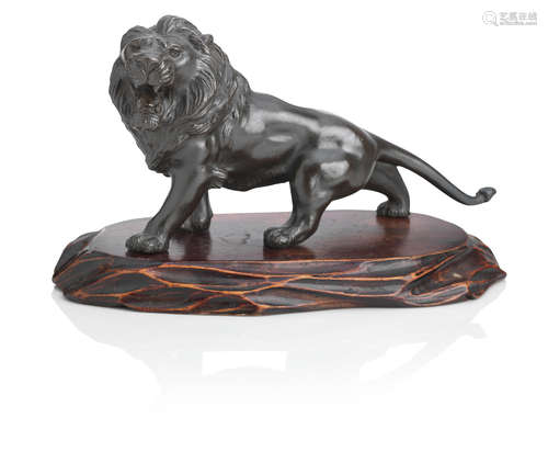 By Genryusai Seiya, Meiji era A bronze lion on wood stand