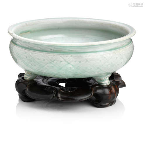 Ming Dynasty A large celadon tripod incense burner on a fitted wood stand