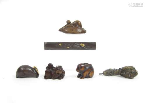 Meiji era A wooden netsuke of an actor and three other netsuke