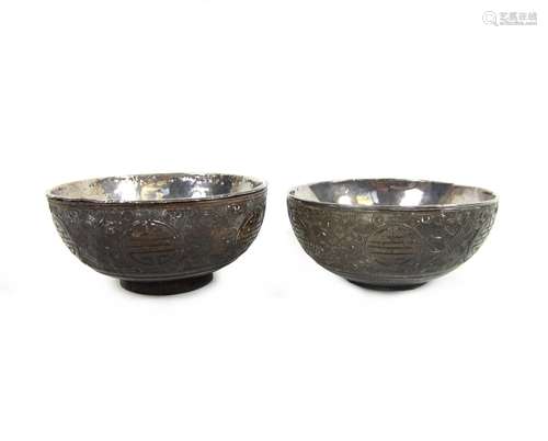 19th century A pair of carved coconut cups