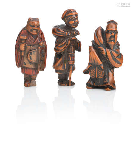 Meiji era Three wooden netsuke of standing figures