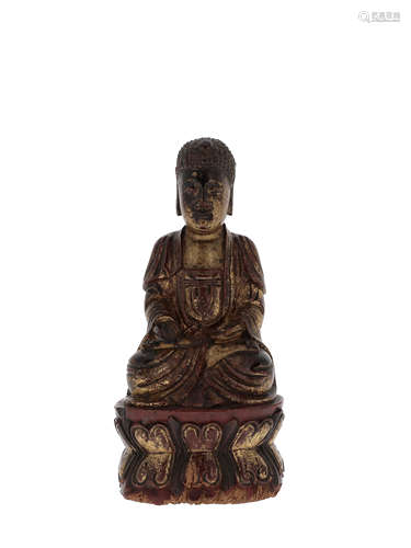 INDOCHINE, XIXe siècle  Petite statuette de bouddha en bois laqué doré