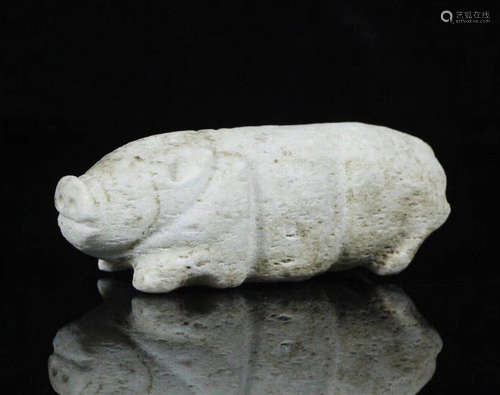 AN OLD JADE PIG FIGURE