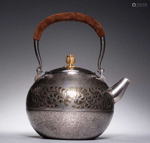 A SILVER MOLDED HANDLE WATER POT