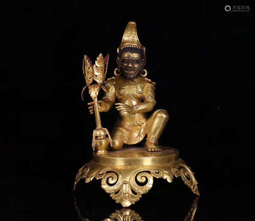 A GILT BRONZE MOLDED BUDDHA STATUE