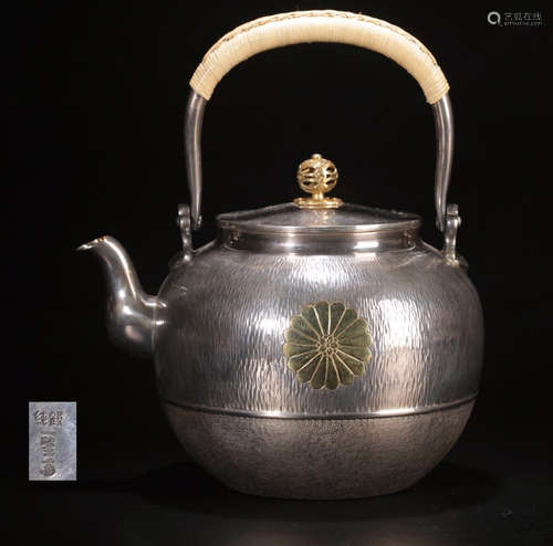 A SILVER MOLDED HANDLE WATER POT