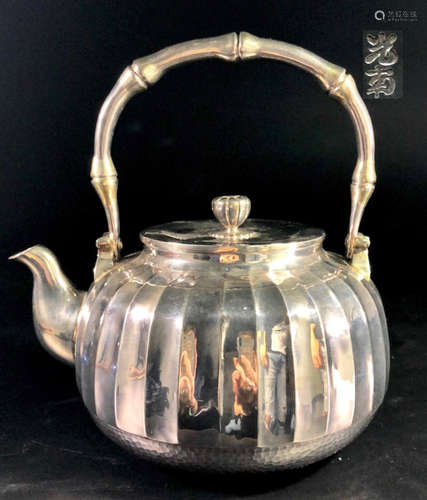 A SILVER WATER POT