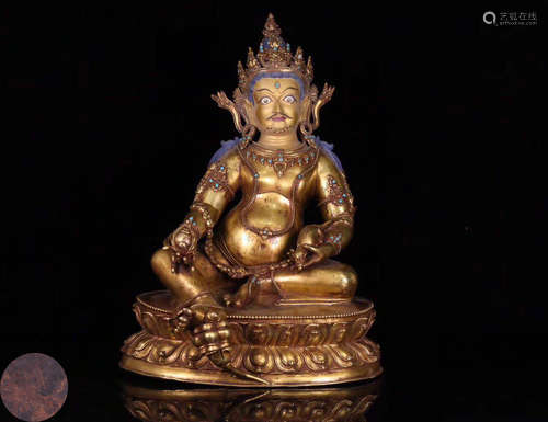 A GILT BRONZE MOLDED BUDDHA STATUE