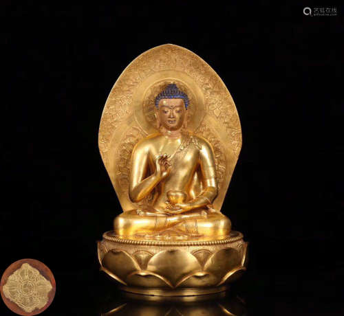 A GILT BRONZE MOLDED BUDDHA STATUE