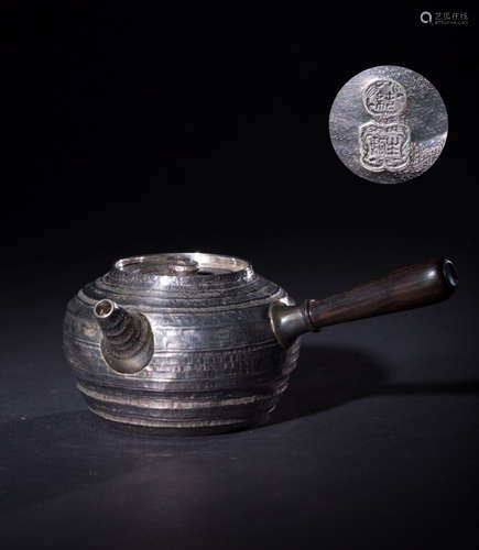 A SILVER MOLDED HANDLE WATER POT